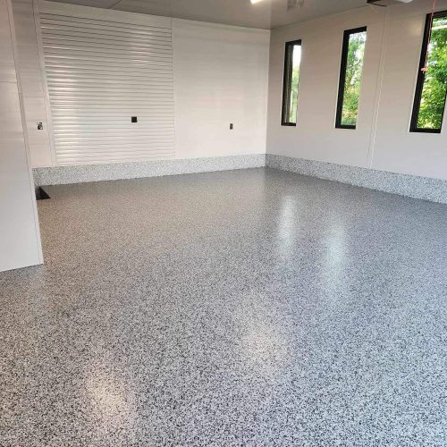 img_1034 alt="polyaspartic floor with vinyl flakes in garage"