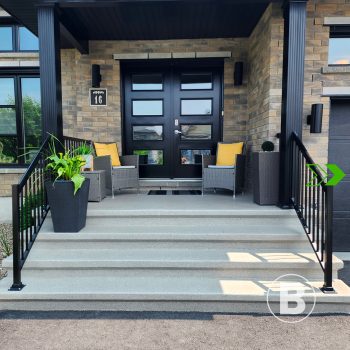 alt="Exterior entrance with steps covered in a light coating."