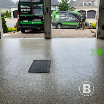 alt="Renovated garage floor with grey flake coating."